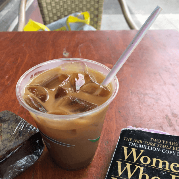 An iced coffee from a local coffee shop in Hawaii with a disposable eco friendly straw in an eco friendly cup