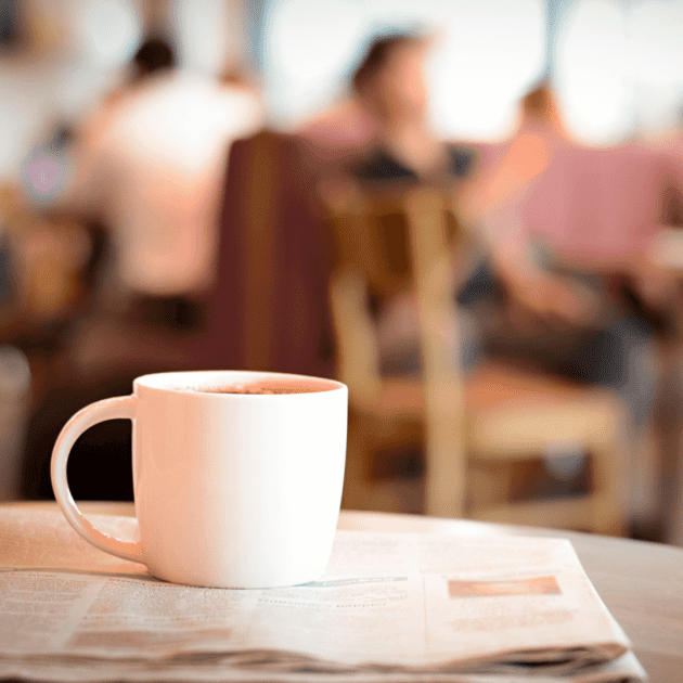 a white coffee mug at a coffee shop