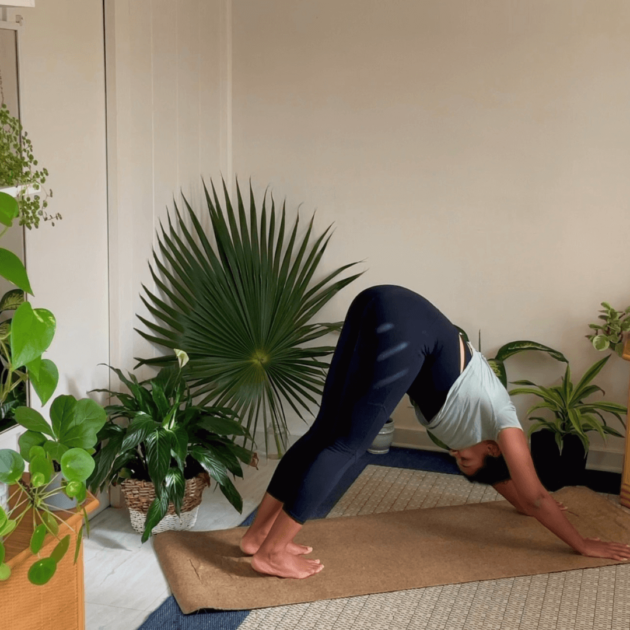 black woman doing yoga at home as a self care practice