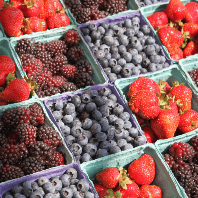 berries at a farmer's market to show different priorities on your budget free journey