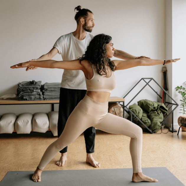 man teaching a yoga class