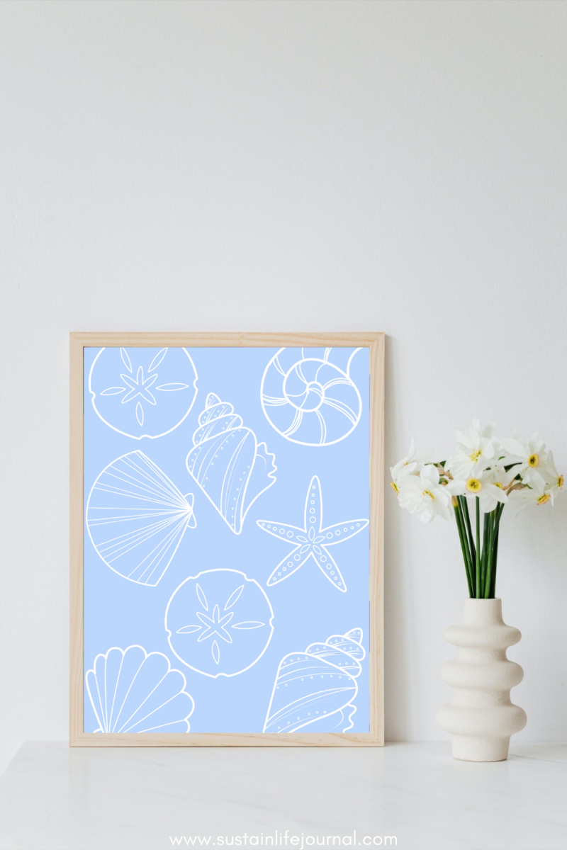 a picture frame with a seashell pattern print in the coastal grandma aesthetic