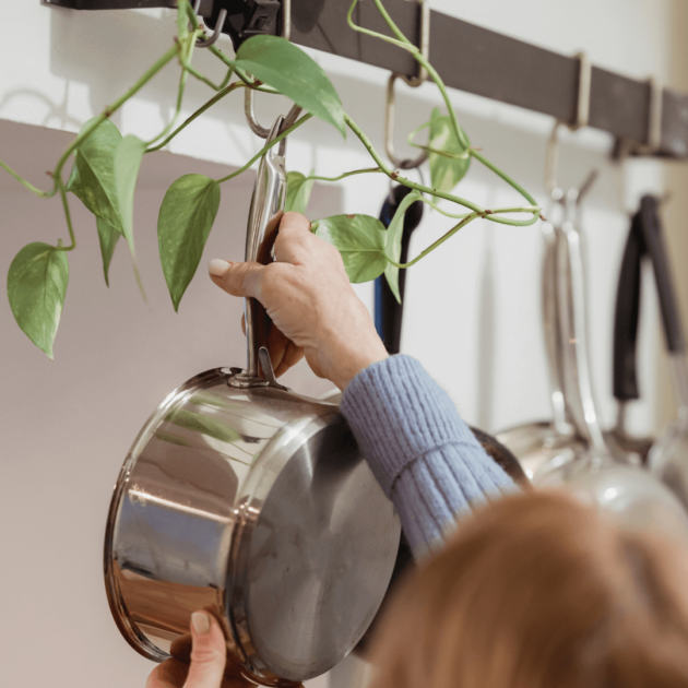 hanging pots on hooks in a tiny kitchen