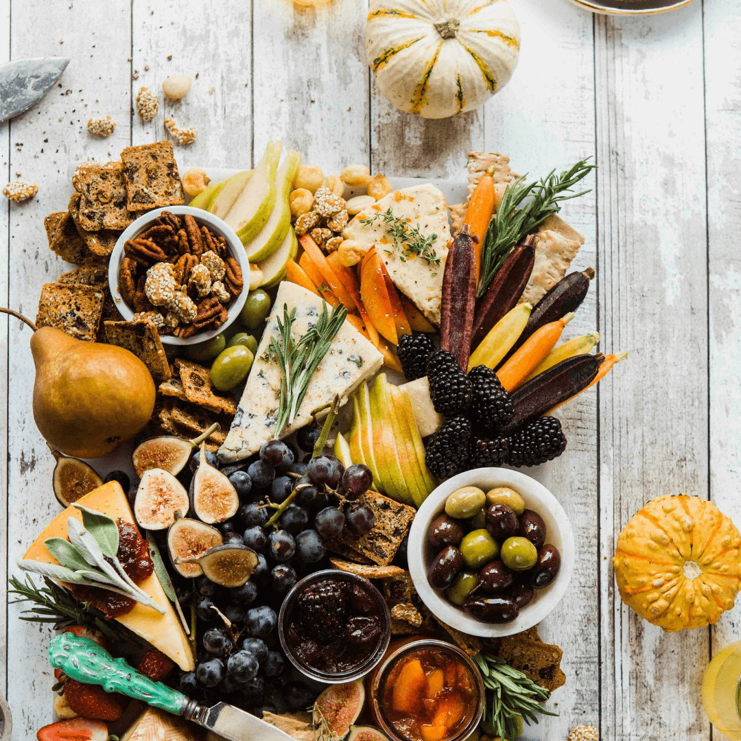 a full charcuterie board made with figs, olives and carrots